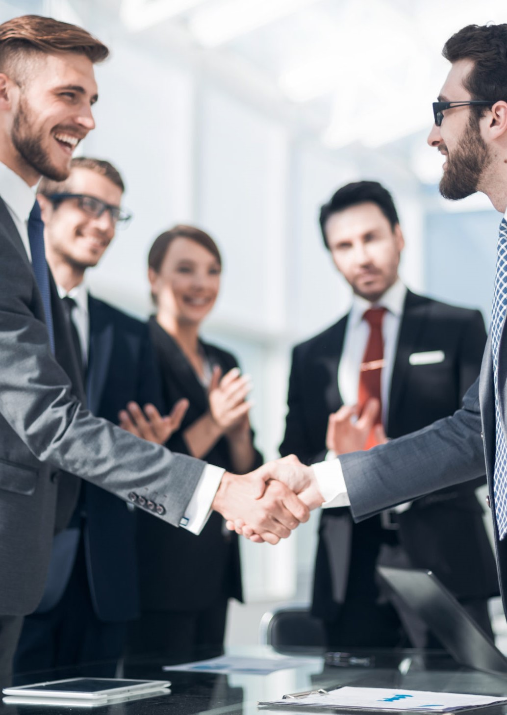 handshake of business people in a modern office